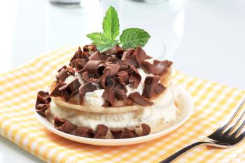 Pancakes with creamy cheese topped with chocolate curls