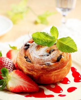 Pain au raisin with fresh strawberries