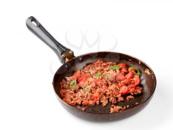 Spicy meat stir fry in a frying pan