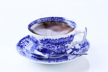 Hot tea in an ornate teacup