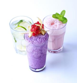 Berry fruit smoothies and chilled soda with lime