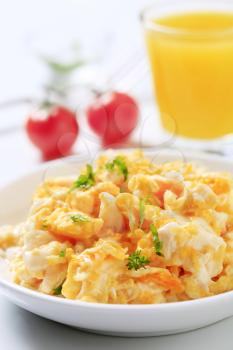 Scrambled eggs and a glass of juice