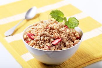 Bowl of crunchy granola with dried strawberries