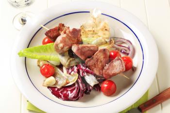 Pork kebab and vegetable accompaniment