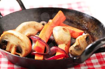 Pan seared  mushrooms, and strips of carrot