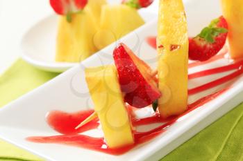 Pineapple and strawberry skewer with sweet sauce