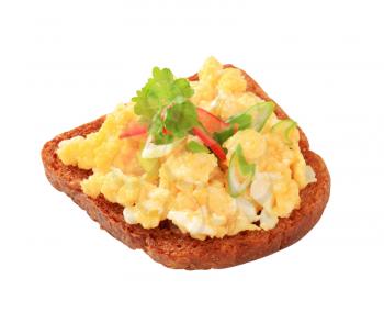 Scrambled eggs on slice of fried bread