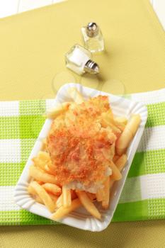 Fried breaded fish fillet with French fries