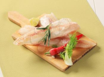 Fresh fish fillets on a cutting board