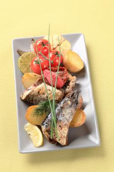 Pieces of crispy spiced mackerel with new potatoes