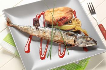 Roasted whole mackerel with potato and raspberry balsamic reduction