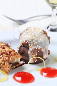 Chocolate-coated marshmallow teacake and fruit-filled bar cookie