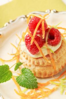 Cream filled vol-au-vent  topped with fresh raspberries