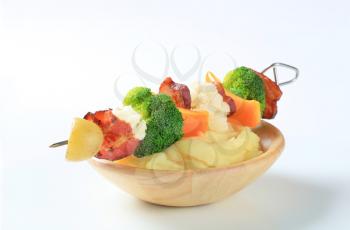 Bacon and vegetable skewer with mashed potato