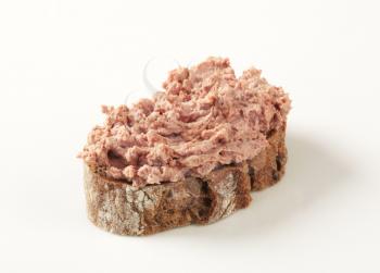 Slice of brown bread and  liver pate