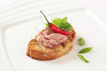 Slice of toasted bread and liver pate
