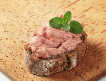 Slice of brown bread and smooth liver pate