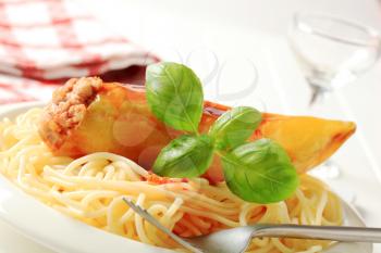 Hot yellow pepper stuffed with minced meat served with spaghetti