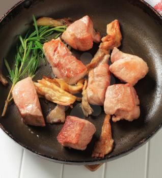 Pieces of pork pan fried with oyster mushrooms 