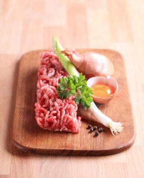 Raw minced meat on a cutting board