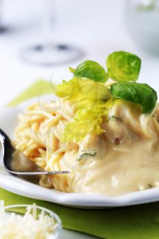 Spaghetti with creamy sauce and grated Parmesan