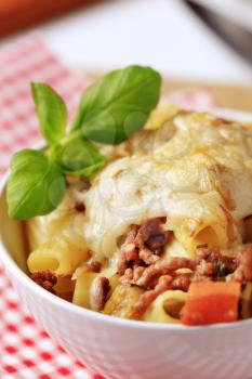 Pasta alla Bolognese with melted cheese on top