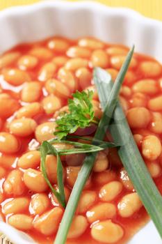 Macro shot of baked beans in a casserole dish