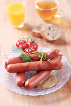 Breakfast of boiled sausages, mustard and bread
