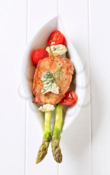 Marinated pork chop with blue cheese and vegetables