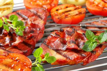Grilled smoked pork steaks and vegetables