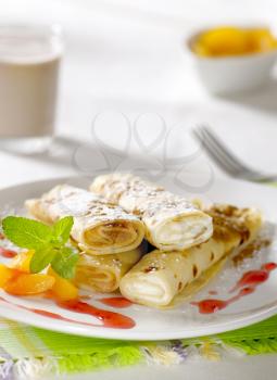 Rolled up crepes filled with sweet fillings 