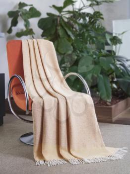 Throw draped over a modern chair - closeup