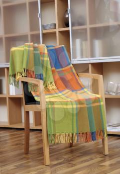 Colorful throw draped over a chair