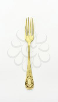 Antique dinner fork with ornate handle