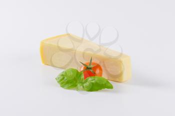 slice of parmesan cheese, tomato and basil