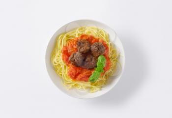 plate of spaghetti and meatballs in tomato sauce