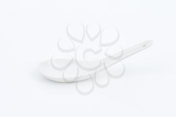 Small porcelain spoon suitable for serving bite size foods, desserts or sauces