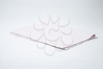 folded white cloth place mat