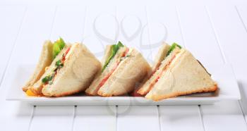 Vegetable double decker sandwiches on long plate