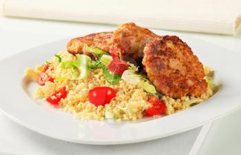 Dish of vegetable burgers with couscous