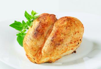 Roasted chicken breasts on a plate