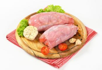 Fresh rabbit meat on cutting board