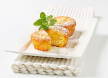 Custard filled muffins on plate