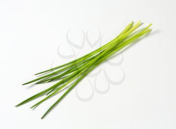Fresh chives leaves on white background