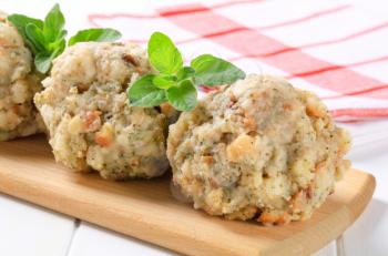 Round bread-and-flour dumplings made with herbs and smoked bacon