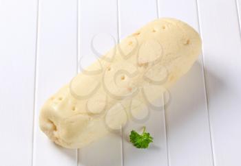 Czech loaf shaped bread dumpling ready to be cut into slices