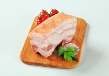 Slab of fresh pork belly with rind