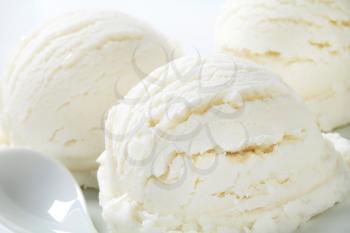 Scoops of white ice cream - lemon, vanilla or coconut flavor