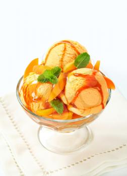 Ice cream with fresh apricot and caramel sauce