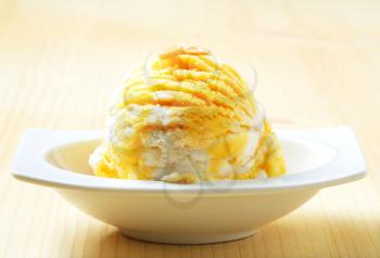Scoop of yellow white ice cream